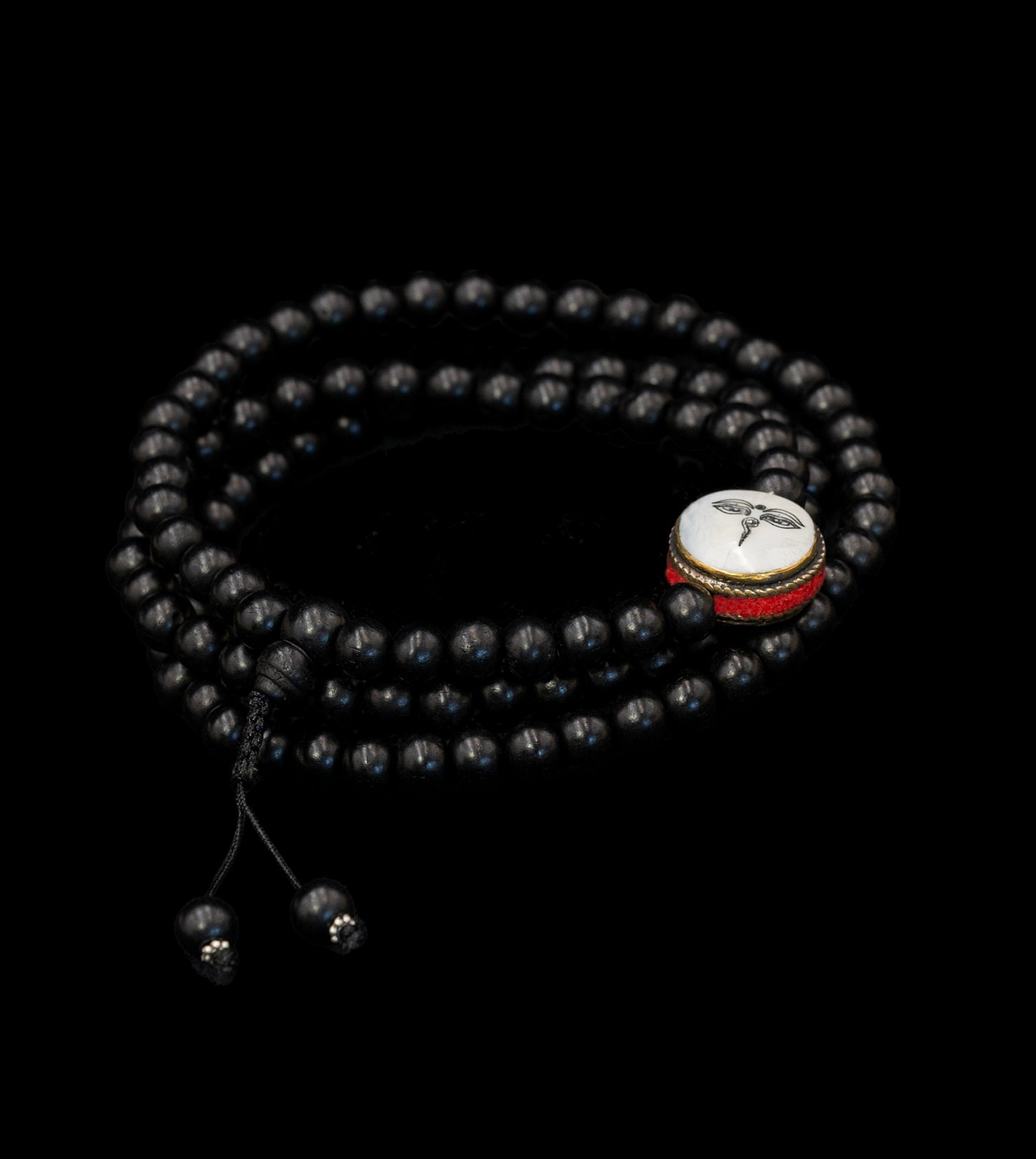 Ebony Wood Mala inlaid with Mother of Pearl stone featuring Buddha eyes – TM015