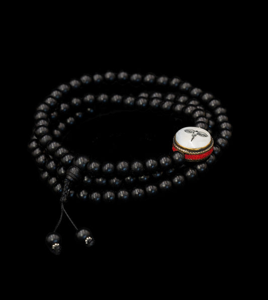 Ebony Wood Mala inlaid with Mother of Pearl stone featuring Buddha eyes – TM015